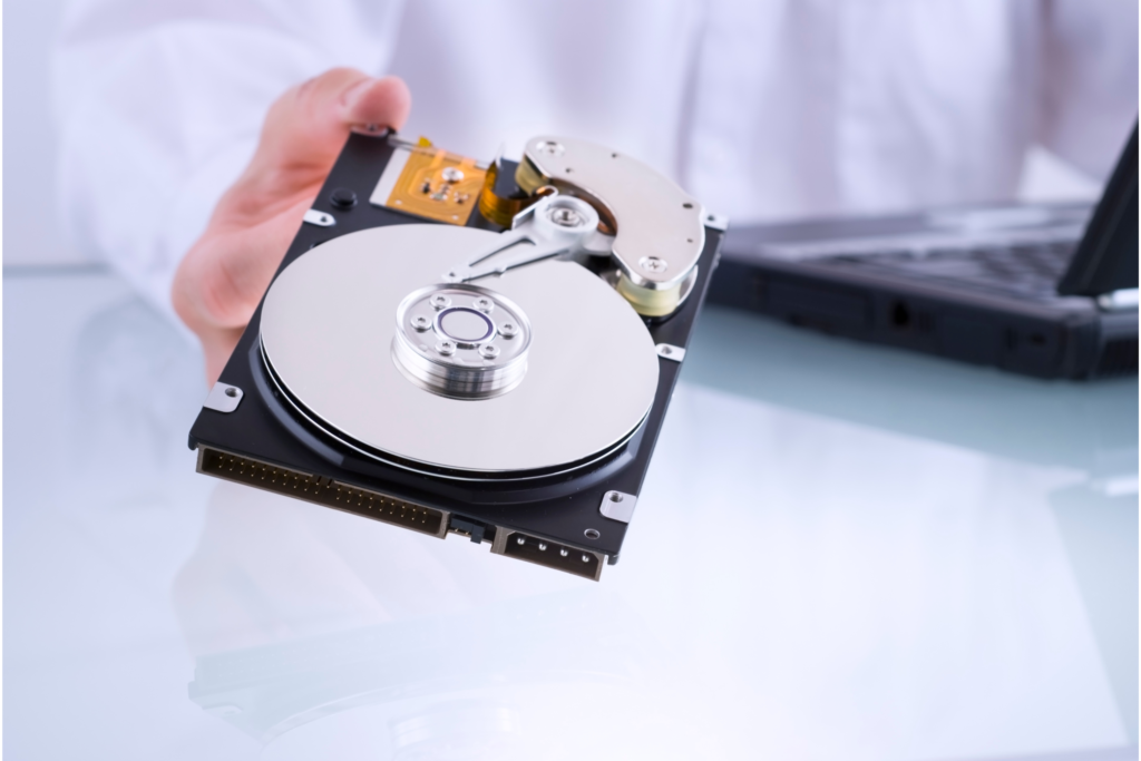 A technical professional recovering data from a broken hard drive